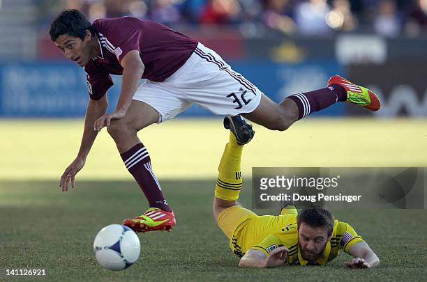 Tony Cascio of the Colorado Rapids and Eddie Gaven of the Columbus Crew battle for control of the ball at Dick's Sporting Goods Park on March 10,...