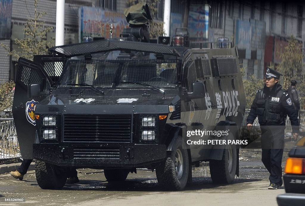 A police armoured personnel carrier sits