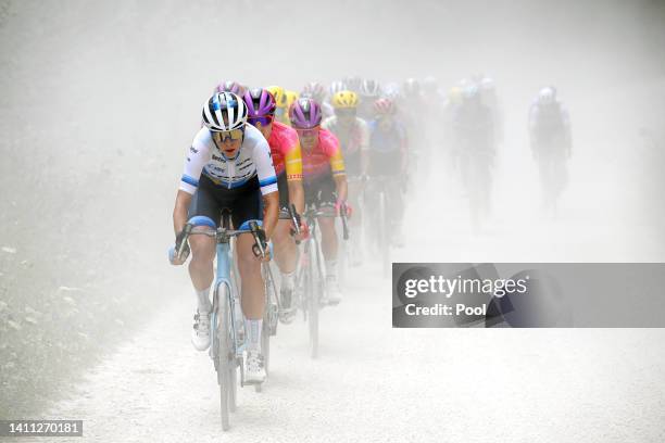 Ellen Van Dijk of Netherlands and Team Trek- Segafredo and Marlen Reusser of Switzerland and Team SD Worx lead the peloton through a gravel road...