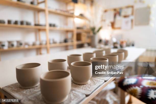 clay products in pottery studio - aardewerk stockfoto's en -beelden