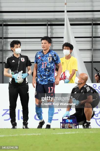 Ryo Miyaichi of Japan injured during the EAFF E-1 Football Championship match between Japan and South Korea at Toyota Stadium on July 27, 2022 in...