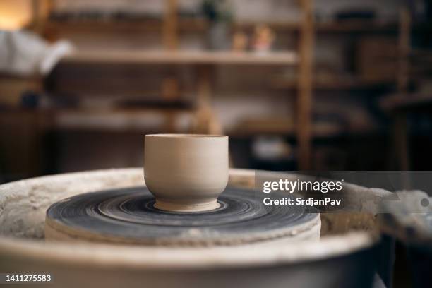 finished clay pot on pottery wheel base - potters wheel stock pictures, royalty-free photos & images