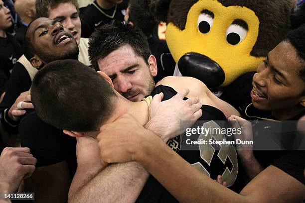 Nate Tomlinson and Austin Dufault of the Colorado Buffaloes celebrate the Buffaloes 53-51 victory against the Arizona Wildcats in the championship...