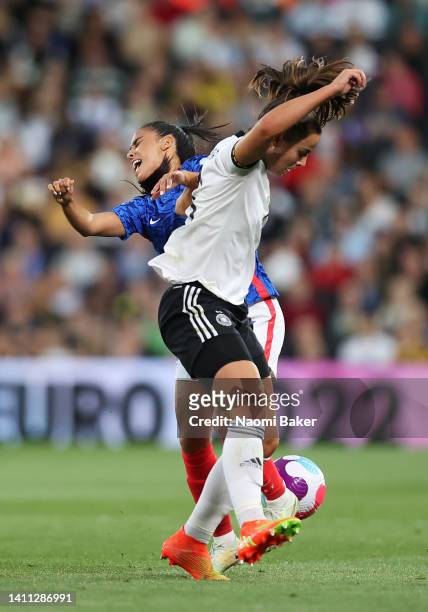 Sakina Karchaoui of France battles for possession with Lena Oberdorf of Germany during the UEFA Women's Euro 2022 Semi Final match between Germany...