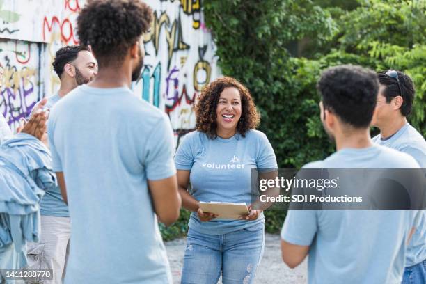 coworkers smile and enjoy each others company - cleaning graffiti stock pictures, royalty-free photos & images