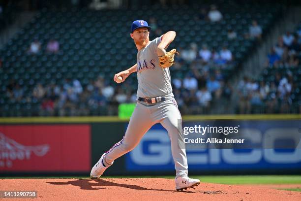 Jon Gray of the Texas Rangers throws a pitch during the first inning against the Seattle Mariners at T-Mobile Park on July 27, 2022 in Seattle,...
