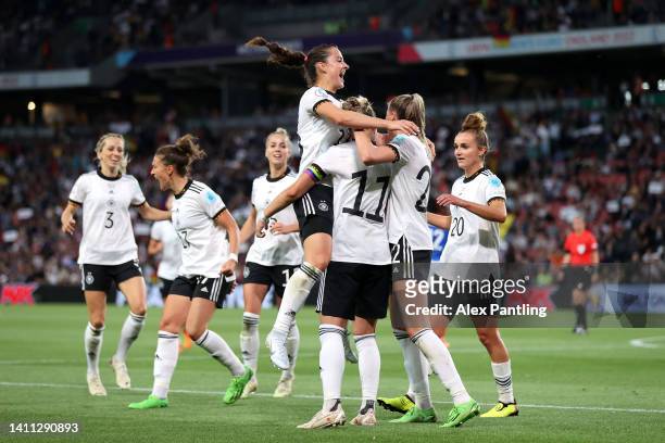 Alexandra Popp of Germany celebrates with teammates after scoring their side's first goal during the UEFA Women's Euro 2022 Semi Final match between...