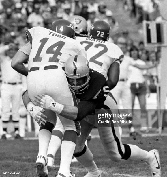 Raiders Howie Long makes a tackle on NY Jets QB Richard Todd during AFC Playoff game, January 15, 1983 in Los Angeles, California.