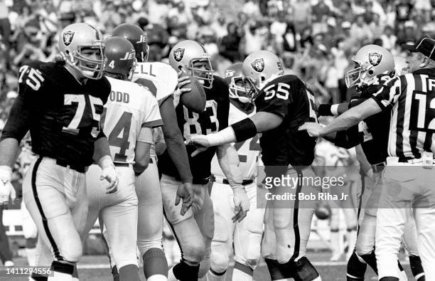 Raiders Ted Hendricks receives congratulations from teammates after recovering a fumble by NY Jets QB Richard Todd during AFC Playoff game, January...