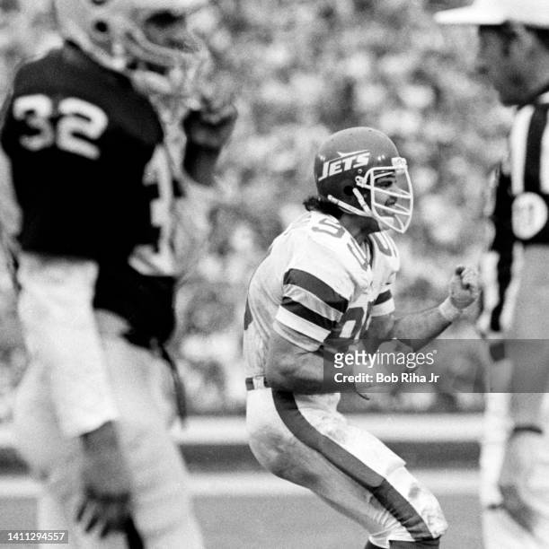 Jets Mark Gastineau reacts after stopping Raiders Marcus Allen on run play during AFC Playoff game, January 15, 1983 in Los Angeles, California.