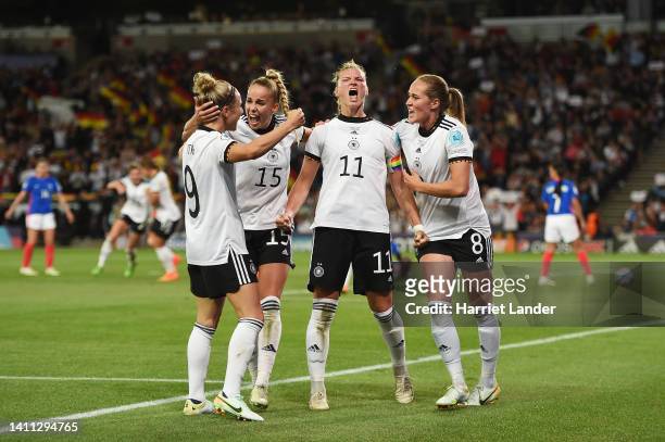 Alexandra Popp of Germany celebrates scoring their side's second goal with teammates during the UEFA Women's Euro 2022 Semi Final match between...