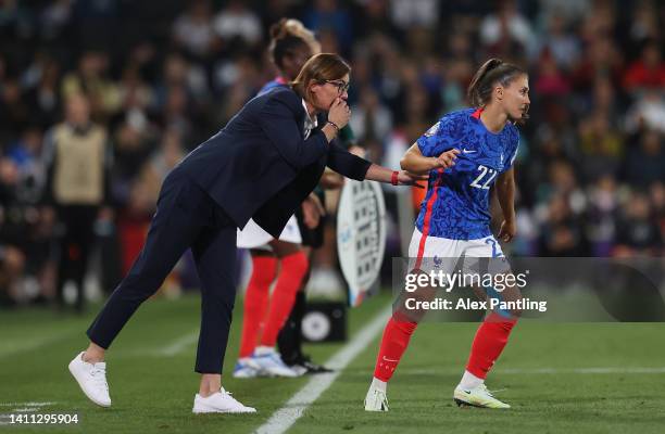 Corinne Diacre, Head Coach of France gives instructions to Eve Perisset of France during the UEFA Women's Euro 2022 Semi Final match between Germany...