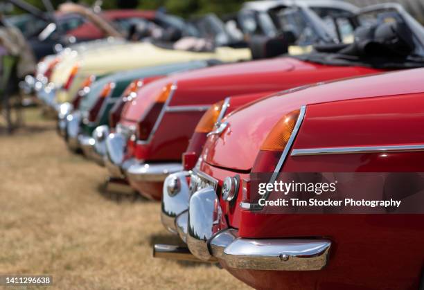 classic british sports cars lined up in a row - classic car stock pictures, royalty-free photos & images