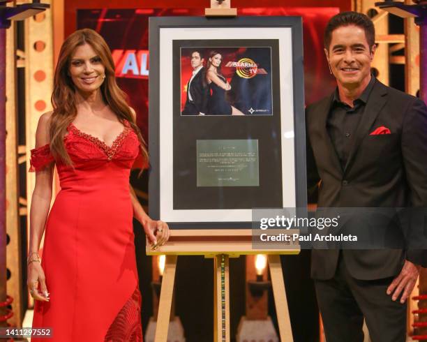 Personalities Lianna Grethel and Jorge Antolin attend the celebration for "Alarma TV's" 4,000th episode at Estrella TV Studios on July 27, 2022 in...