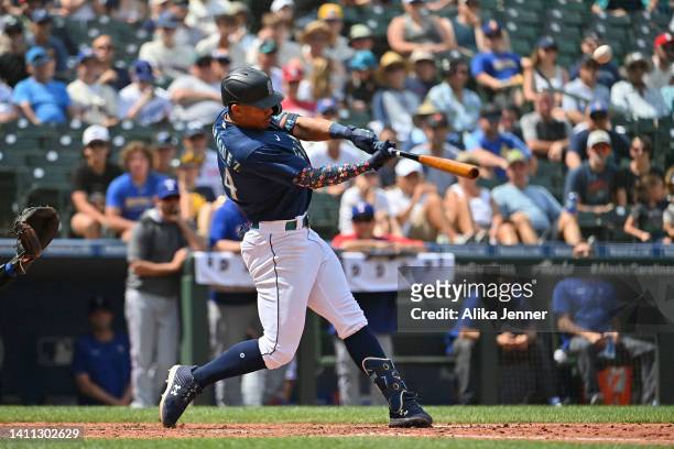 Julio Rodriguez of the Seattle Mariners hits a three run home run during the seventh inning against the Texas Rangers at T-Mobile Park on July 27,...