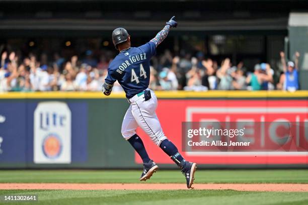 Julio Rodriguez of the Seattle Mariners reacts after hitting a three run home run during the seventh inning against the Texas Rangers at T-Mobile...