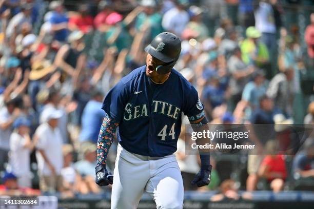 Julio Rodriguez of the Seattle Mariners reacts after hitting a three run home run during the seventh inning against the Texas Rangers at T-Mobile...