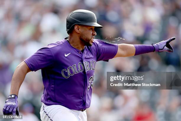 Elias Diaz of the Colorado Rockies celebrates after hitting a 2 RBI walk off single against the Chicago White Sox in the ninth inning at Coors Field...