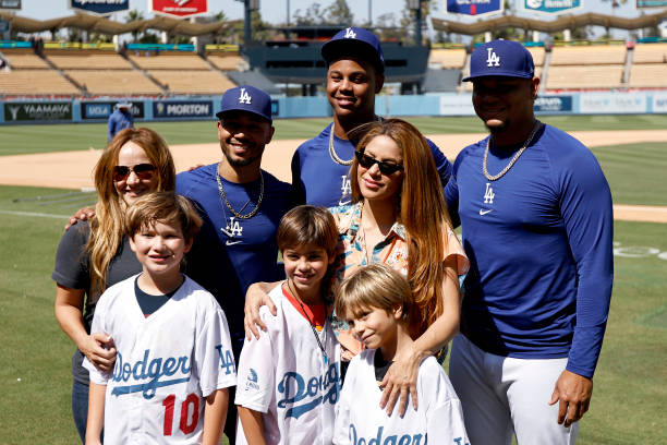 Mookie Betts, Yency Almonte and Brusdar Graterol of the Los Angeles Dodgers pose with Singer Shakira and her two children, Milan Mebarak and Sasha...
