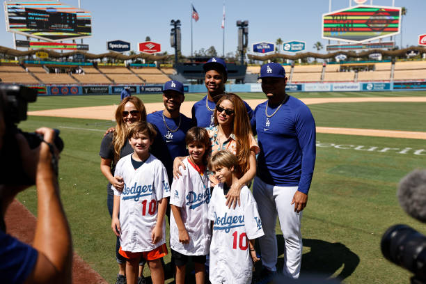 Mookie Betts, Yency Almonte and Brusdar Graterol of the Los Angeles Dodgers pose with Singer Shakira and her two children, Milan Mebarak and Sasha...