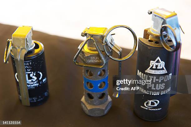 Photo of dispayed non-lethal flash-bang / stun grenades on display during a media event showing non-lethal weapons at the US Marines Corps Base...
