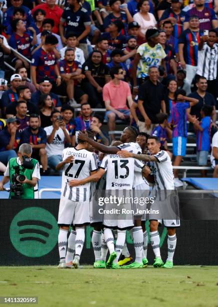 Players of Juventus celebrate a goal scored by Moise Kean of Juventus against FC Barcelona during the first half of an 2022 International Friendly...