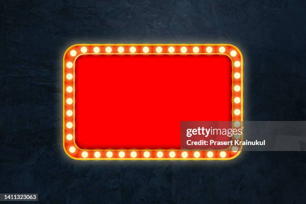 red shining marquee empty banner on dark concrete wall - movie poster stock-fotos und bilder
