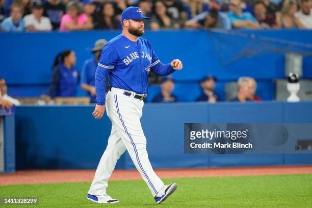 John Schneider manager of the Toronto Blue Jays comes out for a mound visit against the St. Louis Cardinals in the sixth inning during their MLB game...