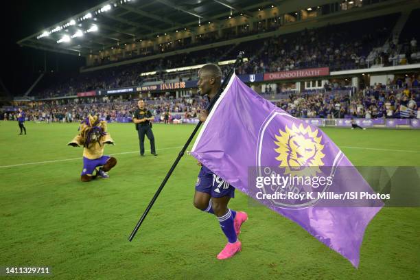 Benji Michel of Orlando City SC carries the team flag after U.S. Open Cup semifinal game between New York Red Bulls and Orlando City SC at Exploria...