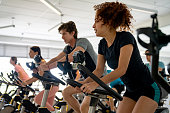 Group of fit people working out in a exercising class