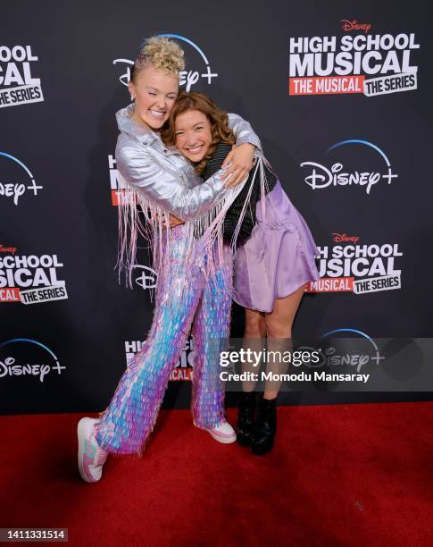 JoJo Siwa and Saylor Bell attends the Disney+ "High School Musical: The Musical: The Series" season 3 premiere at Walt Disney Studios on July 27,...