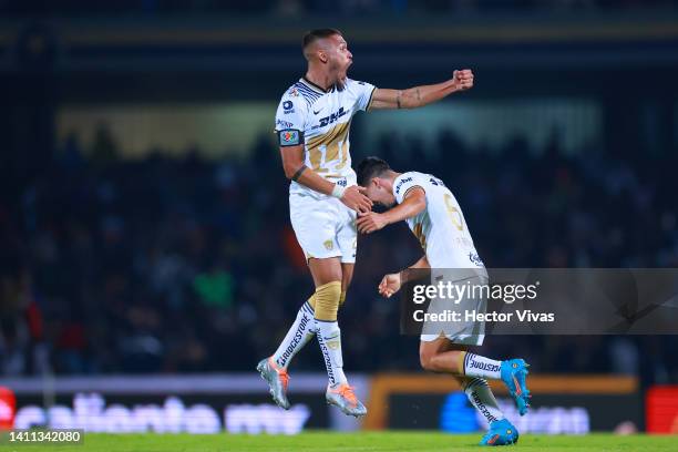 Nicolas Freire of Pumas UNAM celebrates with teammates after scoring his team’s first goal during the 5th round match between Pumas UNAM and Mazatlan...