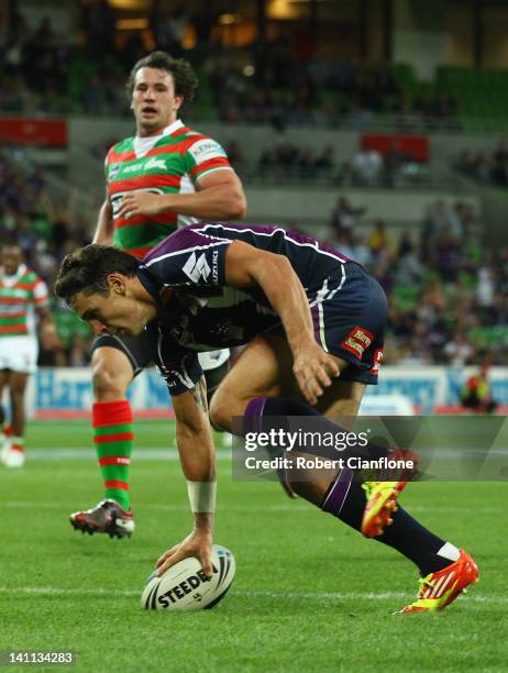 Billy Slater of the Storm scores during the round two NRL match between the Melbourne Storm and the South Sydney Rabbitohs at AAMI Park on March 11,...