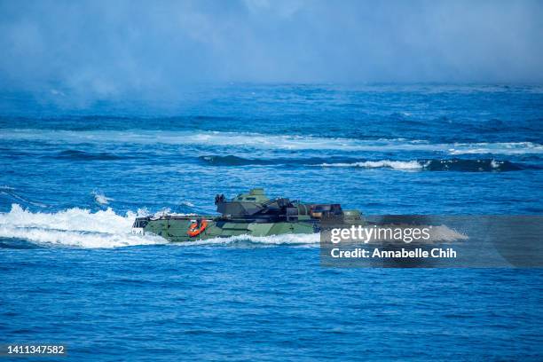 Taiwan's AAV7 amphibious assault vehicle surfaces from the sea during the Han Kuang military exercise, which simulates China's People's Liberation...