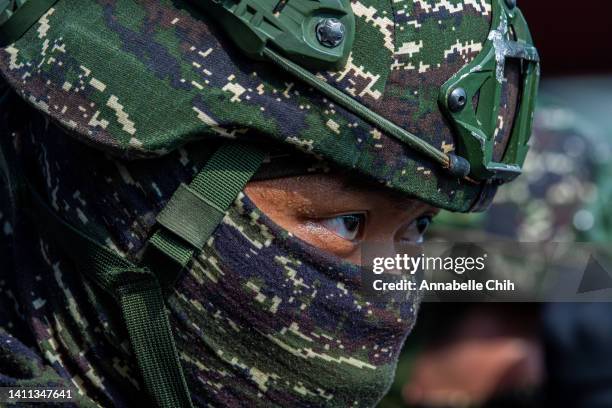 Soldier participates in an amphibious landing drill during the Han Kuang military exercise, which simulates China's People's Liberation Army invading...