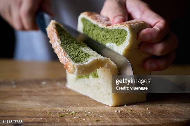 baker slicing matcha loaf - matcha tea stock pictures, royalty-free photos & images