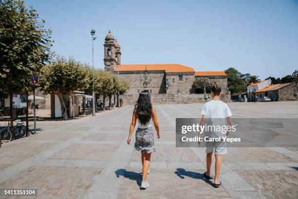 rear view tourist exploring beautiful cambados village spain - pontevedraprovinsen bildbanksfoton och bilder