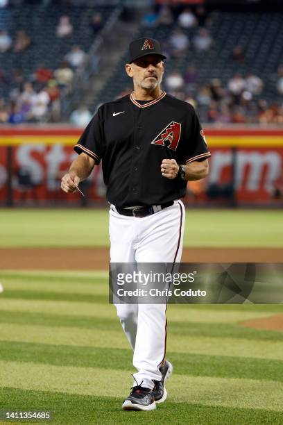 Manager Torey Lovullo of the Arizona Diamondbacks walks off the field after a pitching change during the eighth inning against the San Francisco...