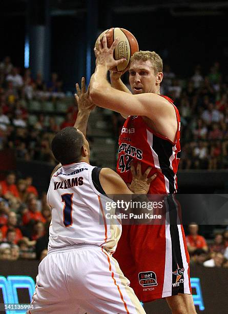 Shawn Redhage of the Wildcats looks to shoot against Kerry Williams of the Taipans during the round 23 NBL match between the Perth Wildcats and the...