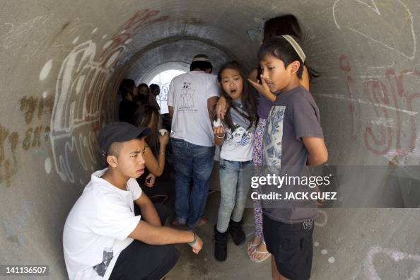 Israelis take cover in a concrete shelte Israelis take cover in a concrete shelte