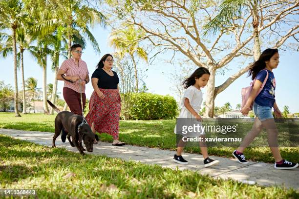 lgbtqia family with two young children and dog - 5 loch stock pictures, royalty-free photos & images