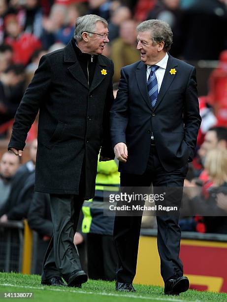 Manchester United Manager Sir Alex Ferguson speaks with West Bromwich Albion Manager Roy Hodgson at the end of the Barclays Premier League match...