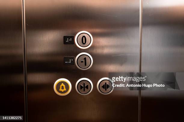 close-up photo of elevator buttons - ascensor interior fotografías e imágenes de stock