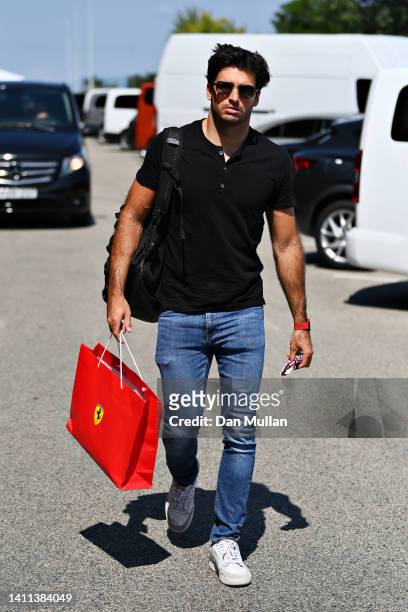 Carlos Sainz of Spain and Ferrari walks in the Paddock during previews ahead of the F1 Grand Prix of Hungary at Hungaroring on July 28, 2022 in...