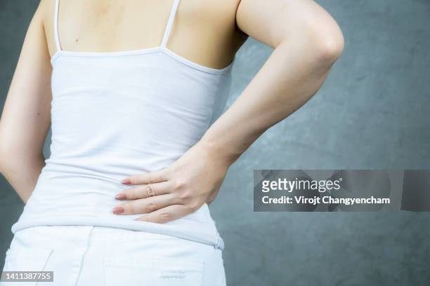 back pain woman - zona lombare foto e immagini stock