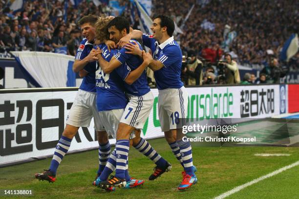 Teemu Pukki of Schalke celebrates the first goal with Klaas-Jan Huntelaar, Raul Gonzalez and Jose Manuel Jurado of Schalke during the Bundesliga...