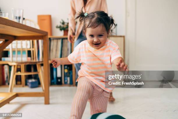 girl running from her mother while playing - moving after stock pictures, royalty-free photos & images