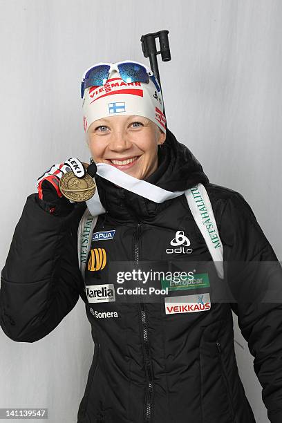 Kaisa Maekaeraeinen of Finnland shows her medal of the IBU Biathlon World Championships Women's Mass Start on March 11, 2012 in Ruhpolding, Germany.