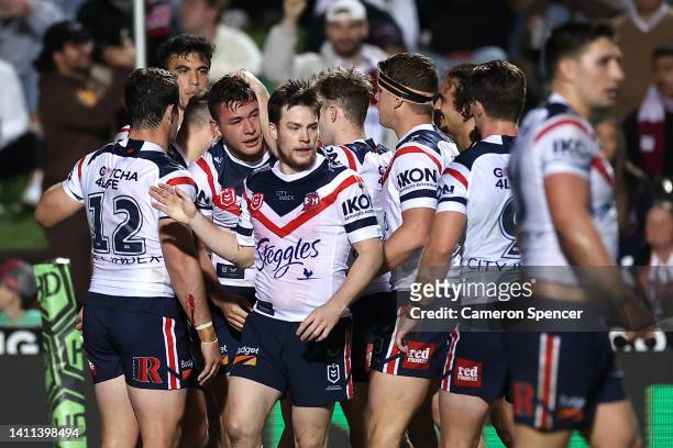 Joseph Manu of the Roosters celebrates with team mates after scoring a try during the round 20 NRL match between the Manly Sea Eagles and the Sydney...