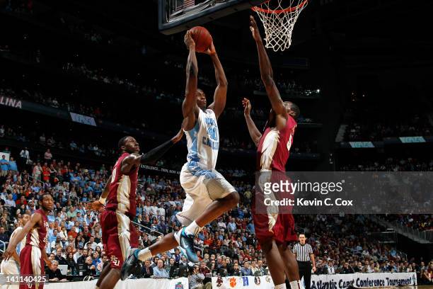 Harrison Barnes of the North Carolina Tar Heels drives for a dunk attempt against Bernard James of the Florida State Seminoles during the Final Game...